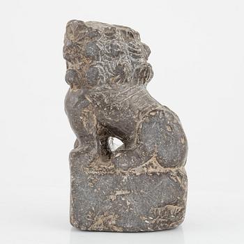 A stone scroll weight/sculpture of a buddhist lion, China, presumably Qing dynasty (1664-1912).