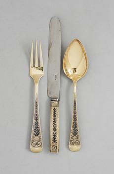 A SET OF THREE RUSSIAN SILVER-GILT AND NIELLO CUTLERY, Moscow 1824.