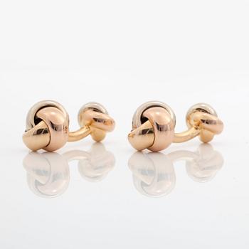 A pair of Cartier "Trinity" cufflinks. Serial number K02862.