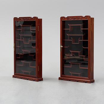 A pair of chinese wall cabinets, 20th century.