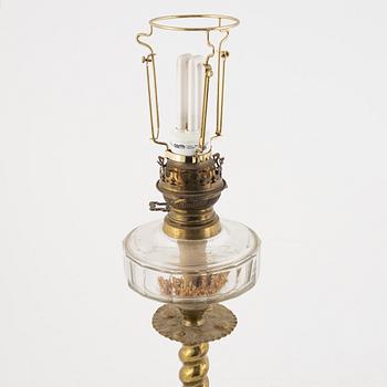 Two Baroque style brass table lamps from around the year 1900.