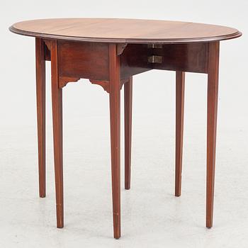 A drop-leaf table, England, early 20th Century.