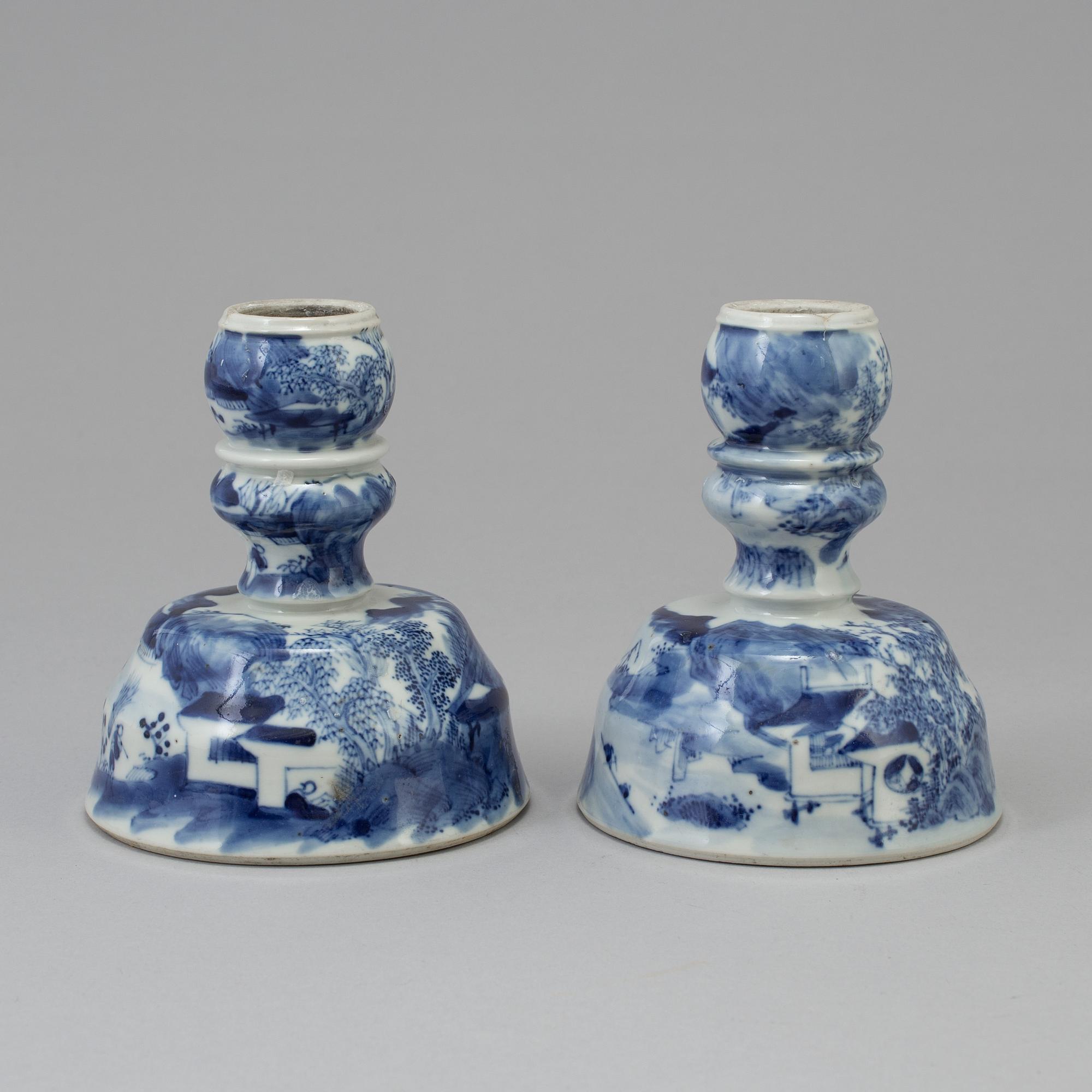 A pair of blue and white candlesticks, late Qingdynasty.