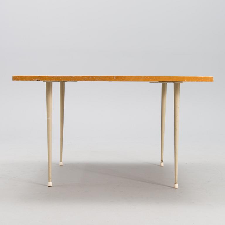 A coffee table marked Tapio Wirkkala, Asko, Made in Finland.