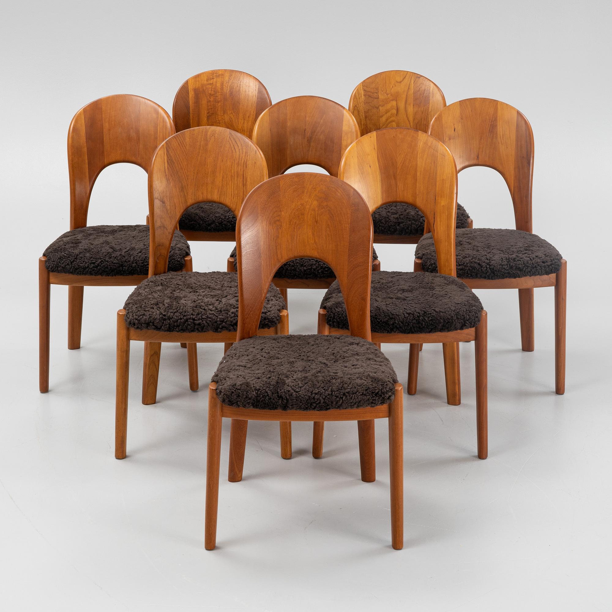 Niels Koefoed, eight teak dining chairs upholstered in new sheep skin, Denmark, 1960's.