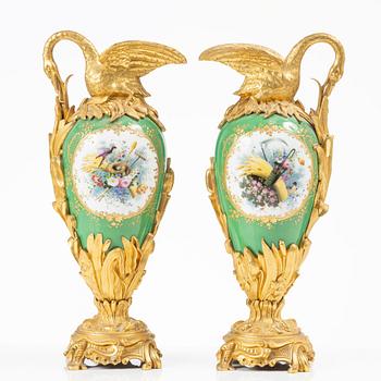 A pair of Louis XV-style gilt bronze and porcelain decorative ewers, France, later part 19th century.