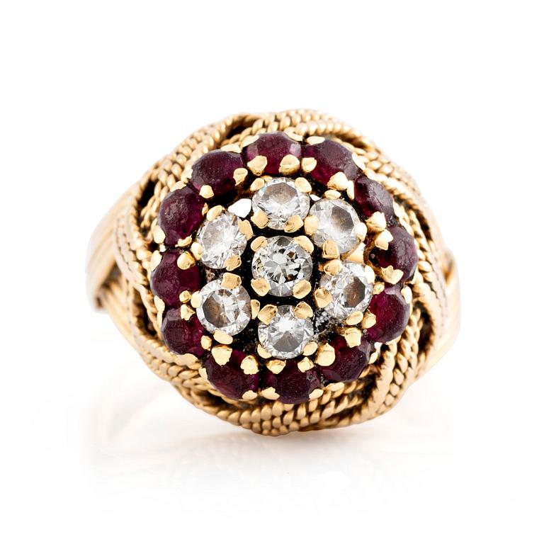 An 18K gold ring set with round brilliant-cut diamonds and rubies.