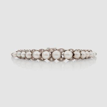 1256. A natural pearl and old-cut diamond bracelet. In a box from David Andersen.
