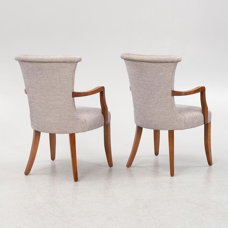 A pair of stained beech armchairs, 20th Century.