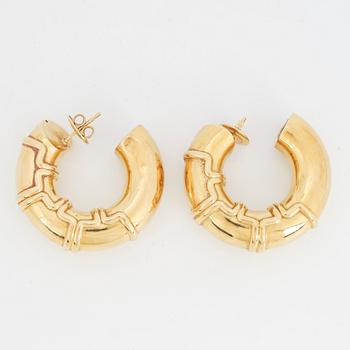 A pair of 18K gold earrings.