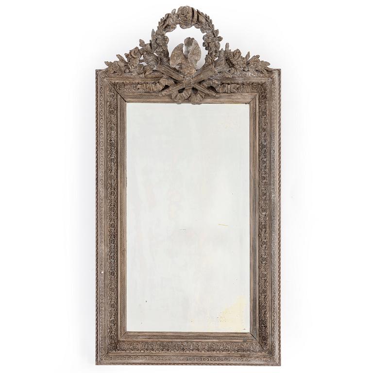 A carved wooden framed mirror, circa 1900.