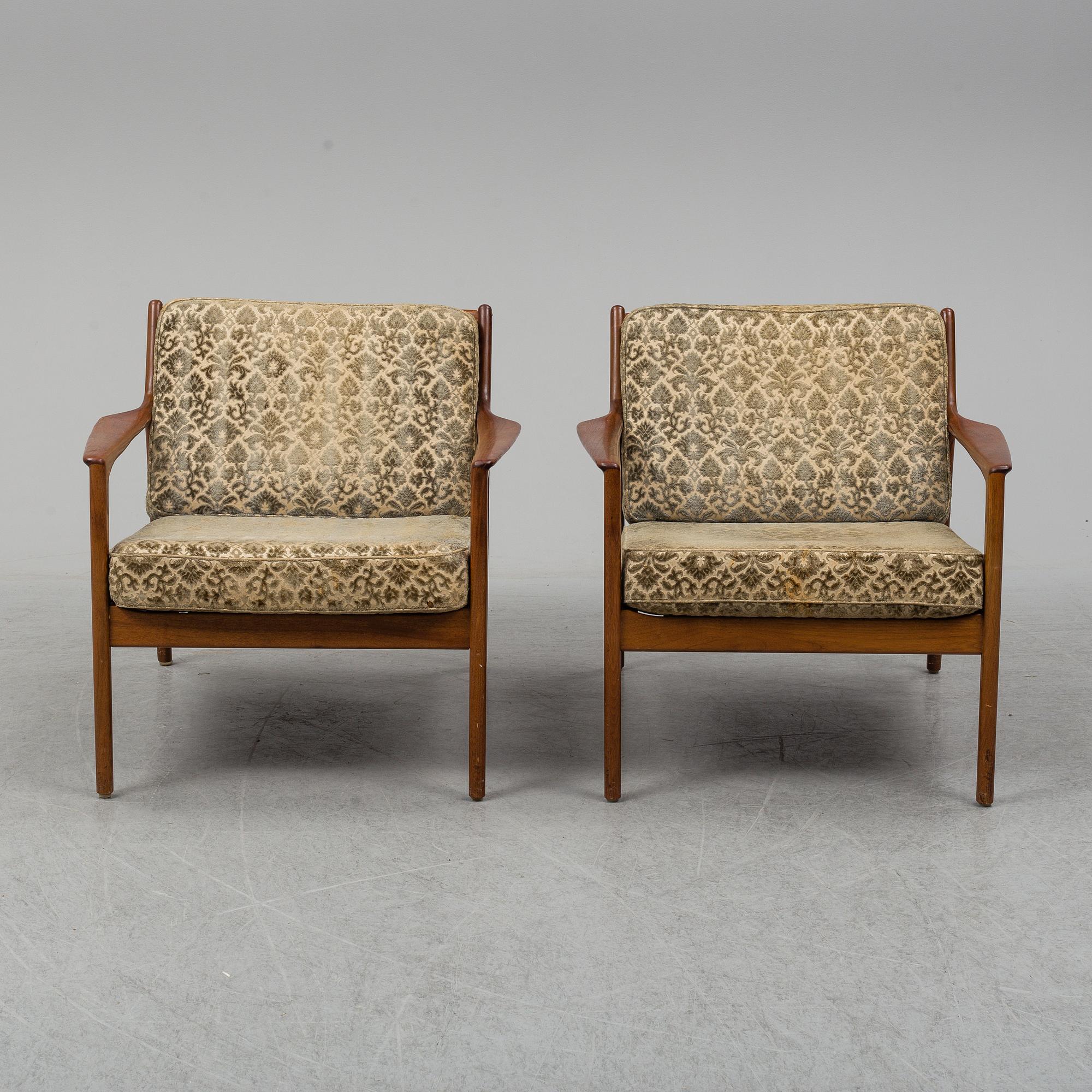 A pair of 'USA 75' teak easy chairs by Folke Ohlsson for Dux.