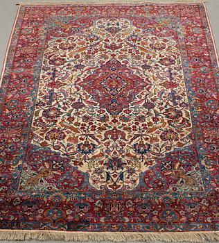 A CARPET, a semi-antique silk Kashan, ca 208,5 x 130 cm.