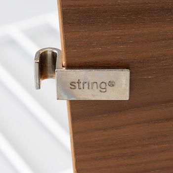 Nils Strinning, a "String" book case with cabinet, Sweden, 21st century.