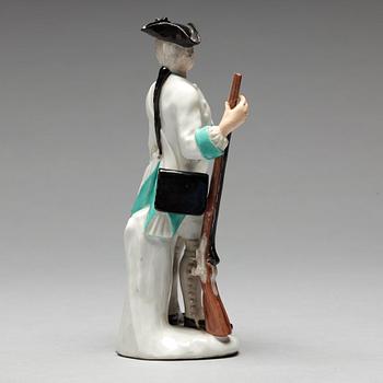 A German unmarked porcelain figure of a huntsman, 18/19th Century.