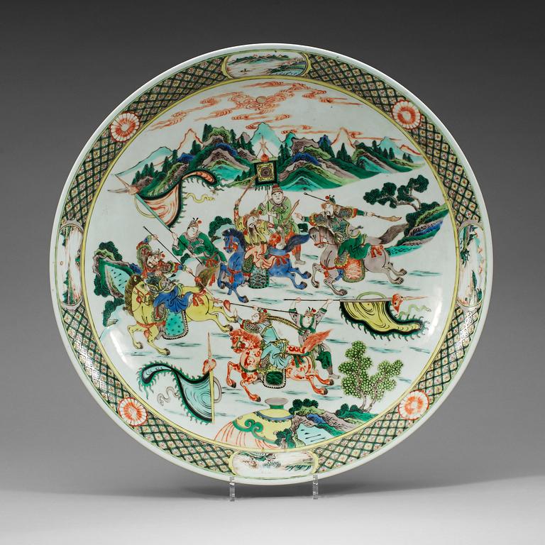 A large famille verte charger, Qing dynasty, 19th Century, with Kangxis six character mark.