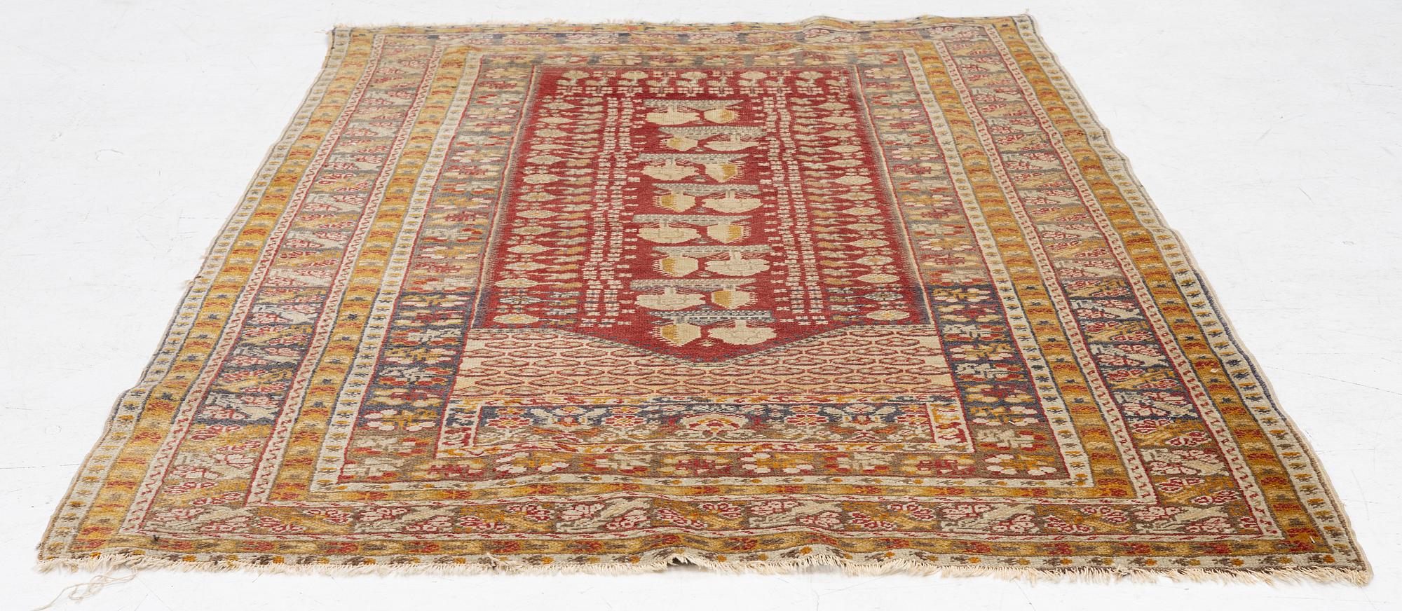 An oriental carpet, c. 195 x 70 cm.