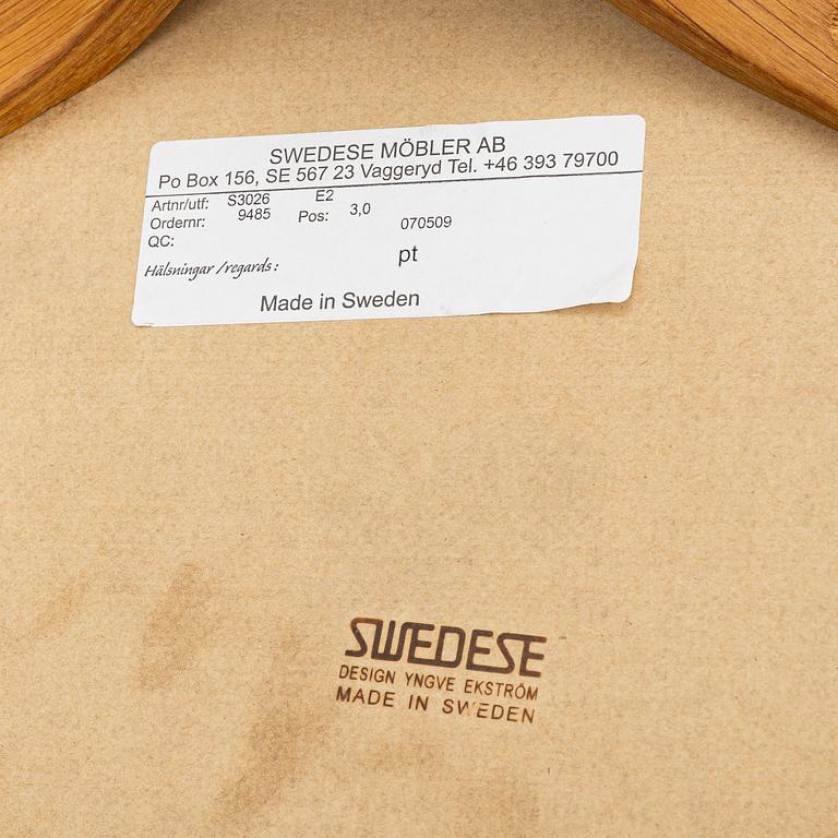 Yngve Ekström, a 'Lamino' armchair and sidetable, Swedese, Sweden, early 21st century.