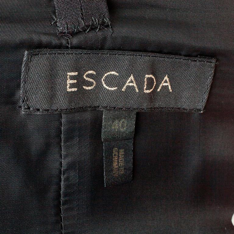 ESCADA, a black cocktail dress with rhinestones.