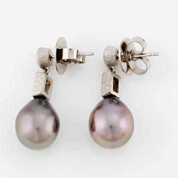 Earrings, a pair, 18K white gold with drop-shaped cultured black pearls and baguette and brilliant-cut diamonds.