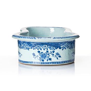 A blue and white bidet with a wooden stand, Qing dynasty, Qianlong (1736-95).