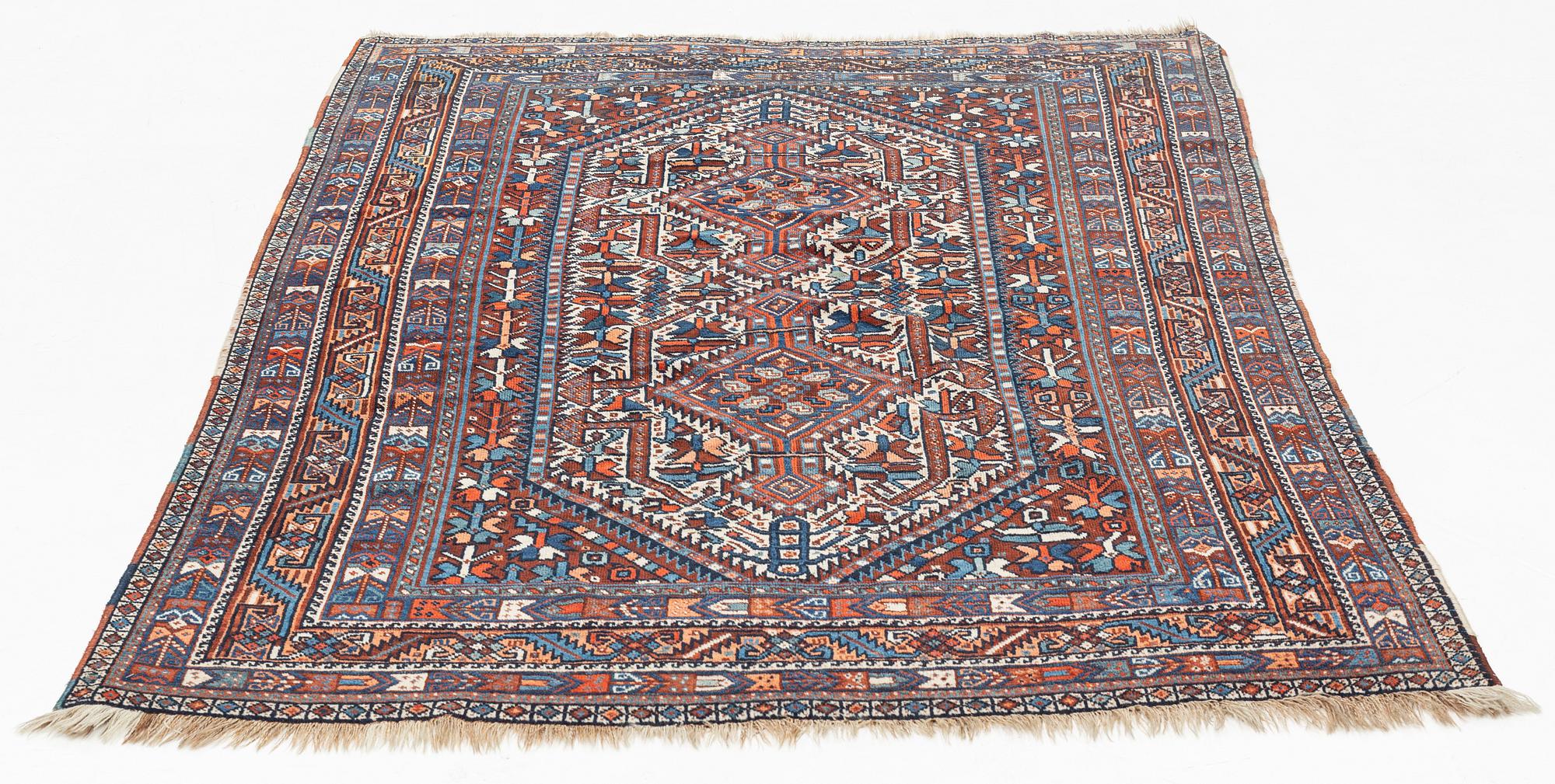 A carpet, Shiraz, circa 211 x 147 cm.