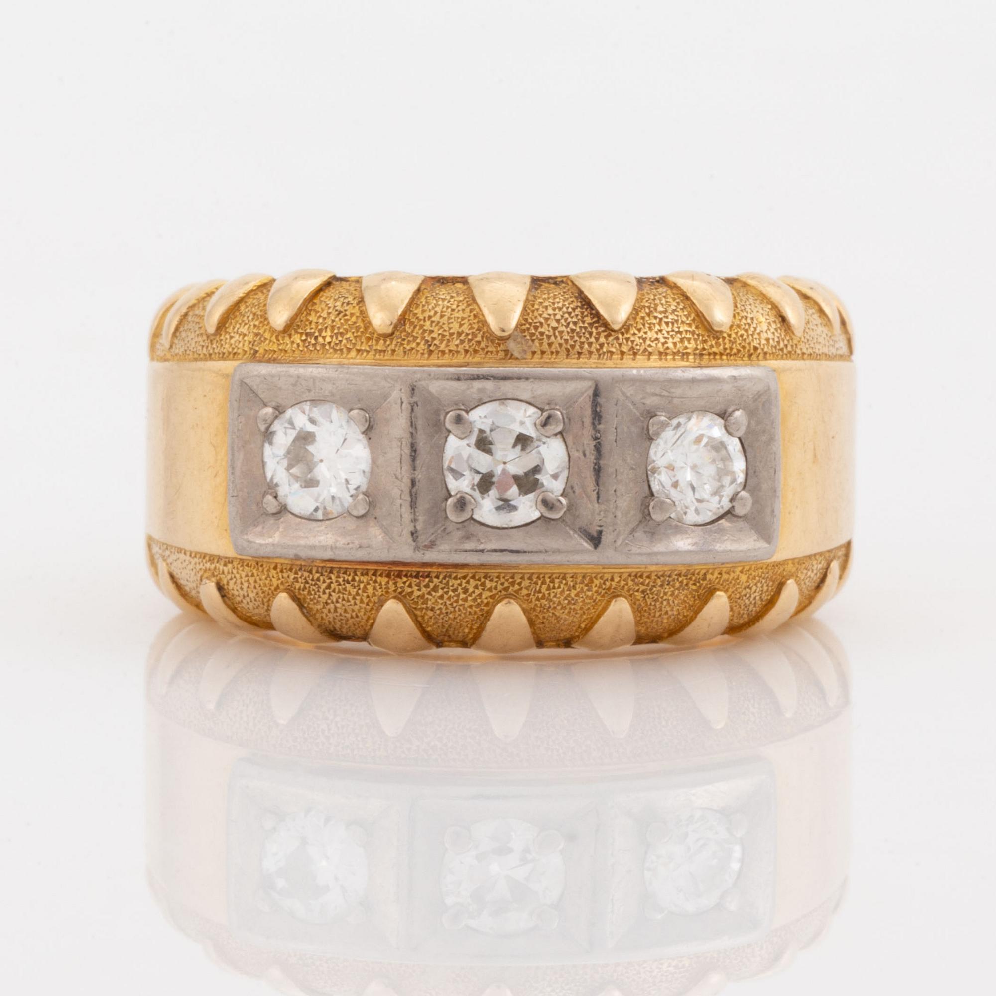 Gold and brilliant cut diamond three stone ring.