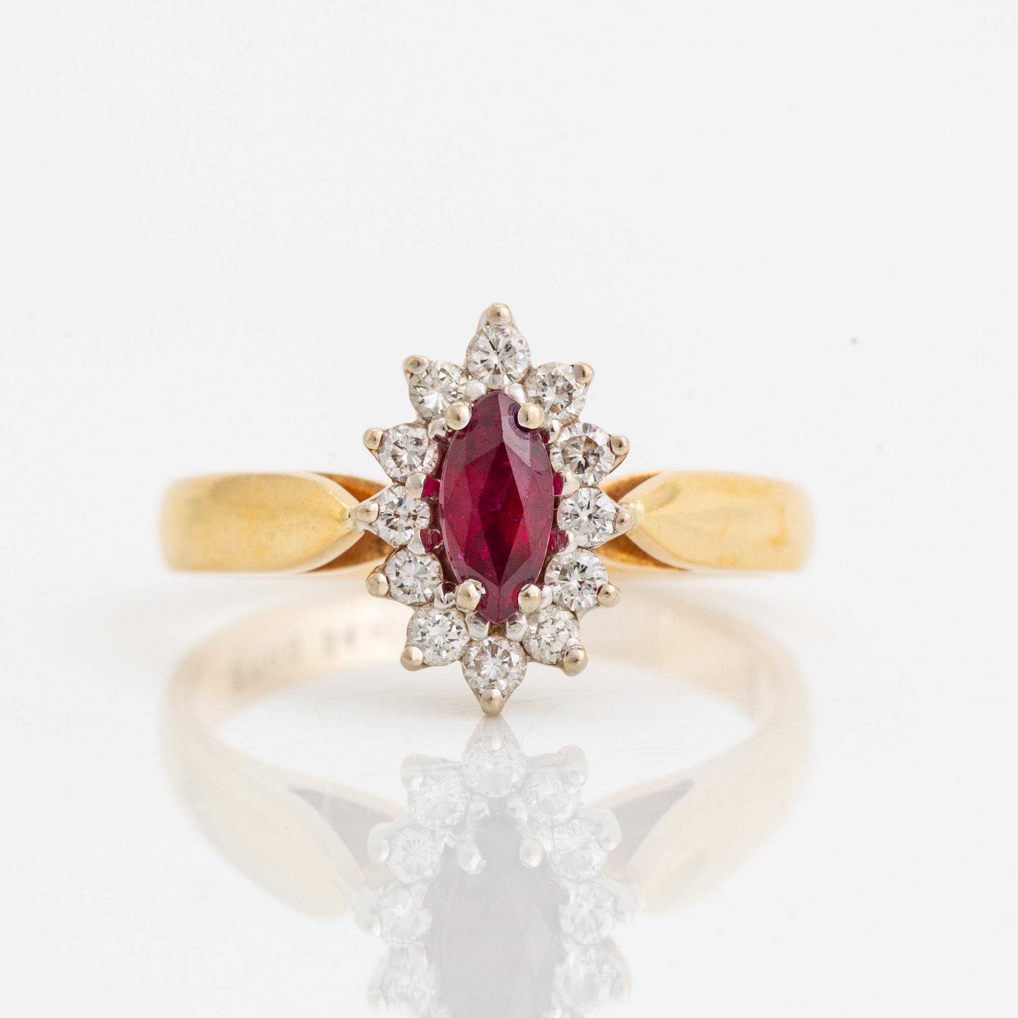 Navette cut ruby and brilliant cut diamond ring.