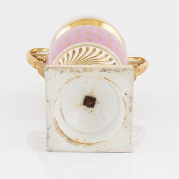 A gilt Empire porcelain vase, 19th Century.