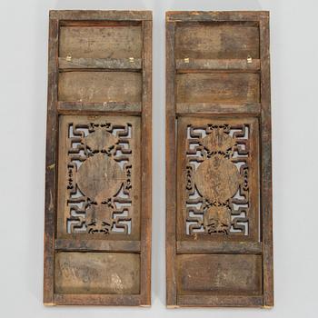 A pair of late Qing dynasty wooden panels, China, 19th/20th century.