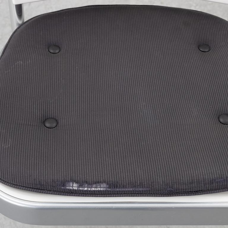 Vico Magistretti, a "Shine" dining table with twelve chairs, De Padova, Italy, around the year 2000.