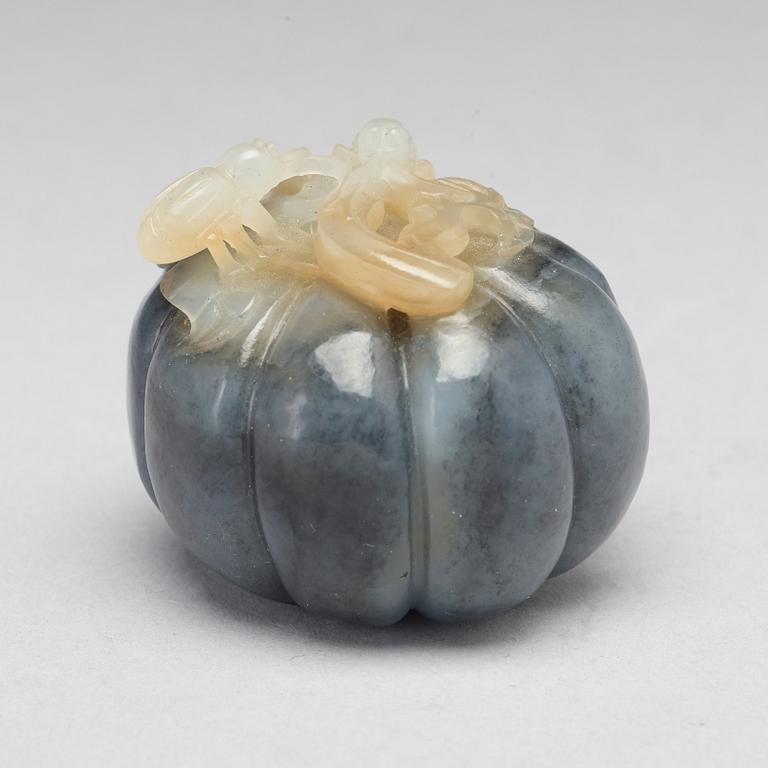 A Chinese nephrite sculpture of insects on a fruit.