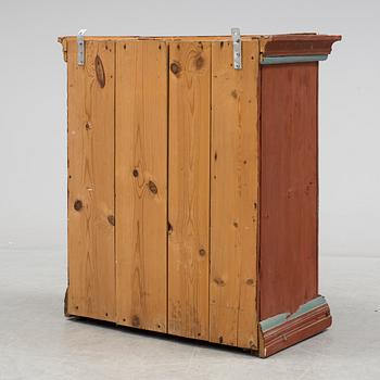 a painted cabinet dated 1828.