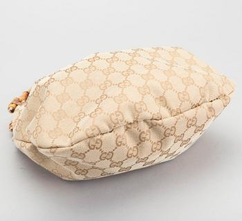 A GUCCI BAG, "STUDDED  BAMBOO HANDLE".