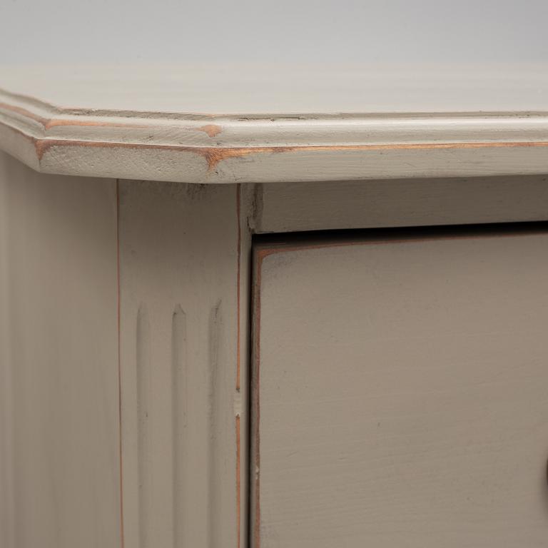 A pair of Gustavian style chest of drawers, mid 20th Century.