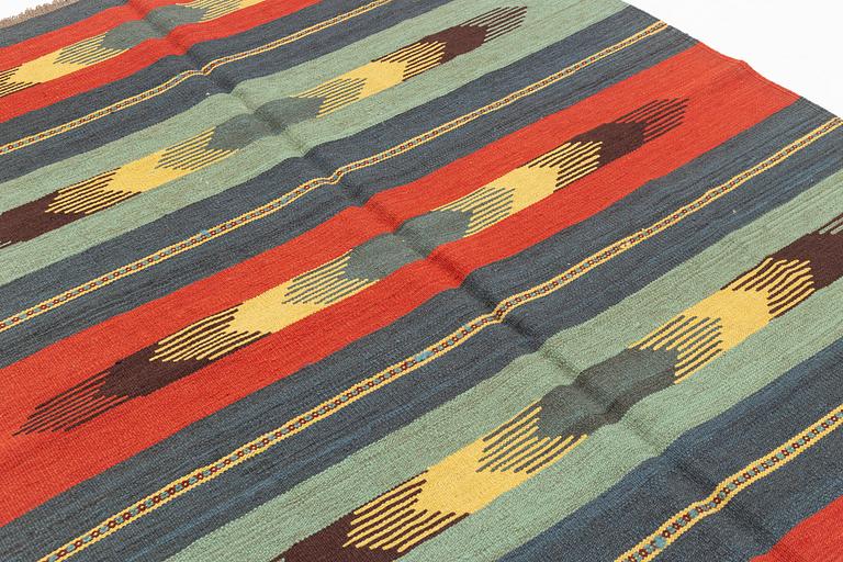 A persian kilim,  ca 242 x 181 cm.