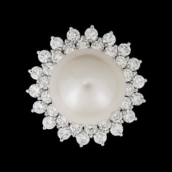 61. A cultivated South Sea pearl, circa 14.5 mm, and diamond, total gem weight circa 3.06 cts. Quality circa H/VS-SI.