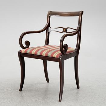 A mahogany veneer desk with desk chair, 20th Century.