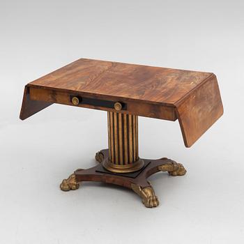 An Empire table, first half of the 19th Century.