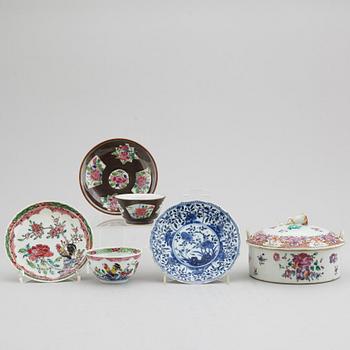 A famille rose butter tureen with cover and two cups with three odd stands, Qing dynasty, Qianlong (1736-95).