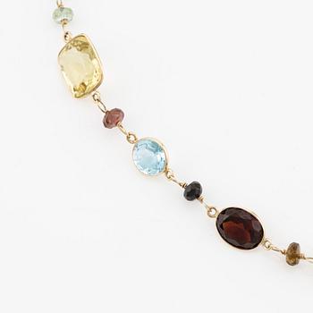 Necklace in 14K gold with various coloured stones.