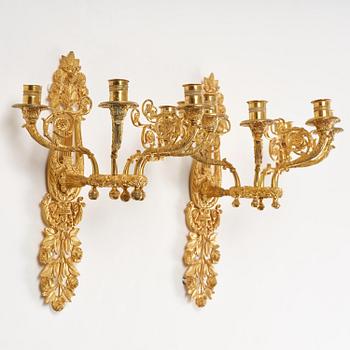 A pair of French 19th century gilt bronze five-light wall-lights.