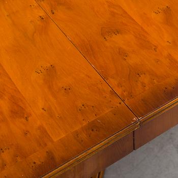 A yew dining table and 8 chairs, second half of the 20th century.