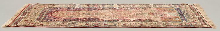 A RUG, an antique/semi-antique Kerman Laver  figural, ca 232,5 x 139,5 cm.