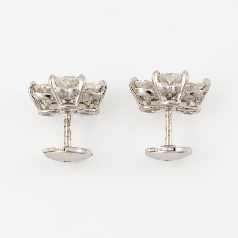 A pair of Cartier earrings in 18K white gold with six heart-shaped brilliant-cut diamonds.