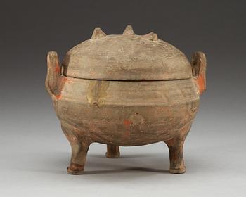 A potted ding tripod censer with cover, Han dynasty (206 BC - 220 AD).