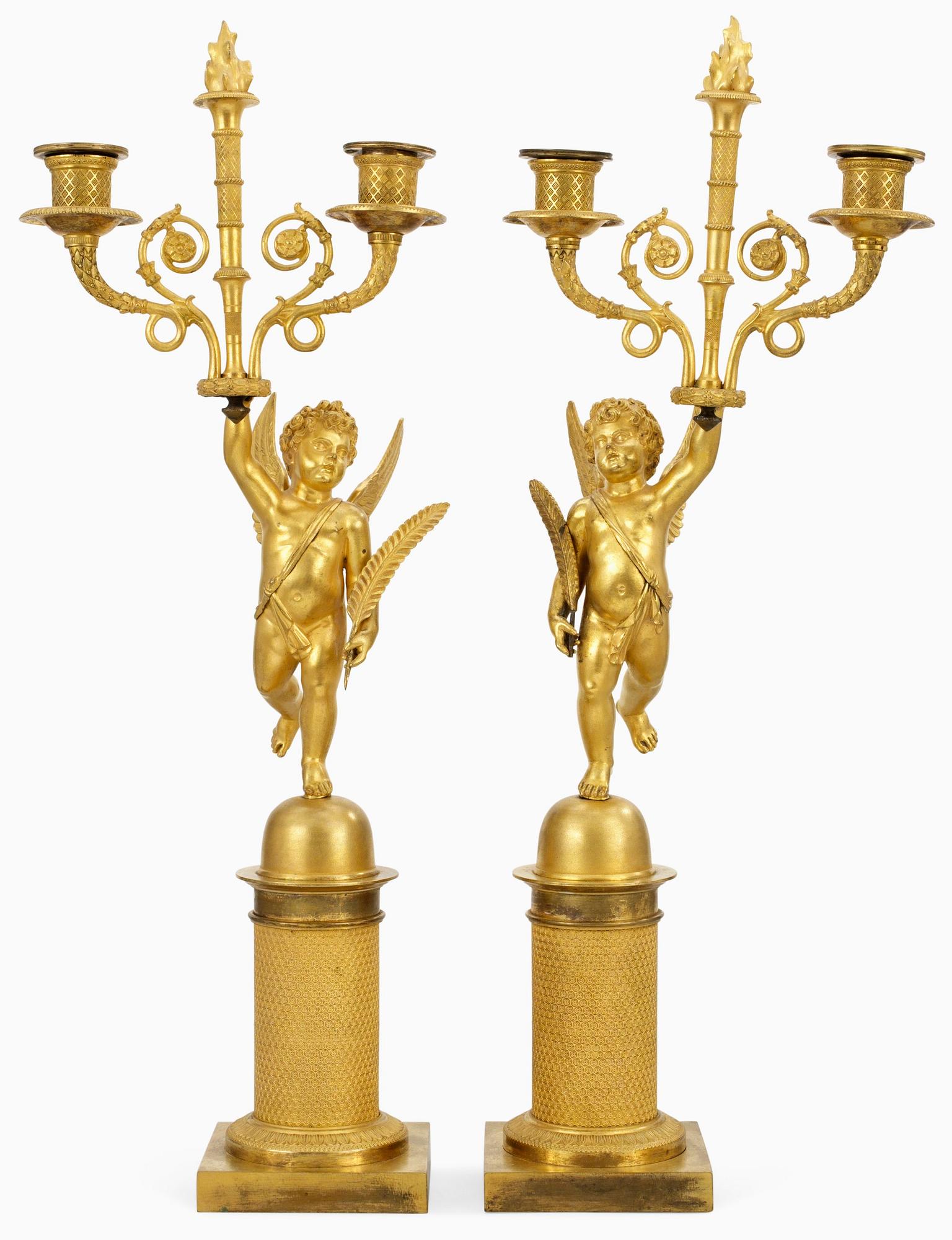 A pair of French Empire two-light candelabra.