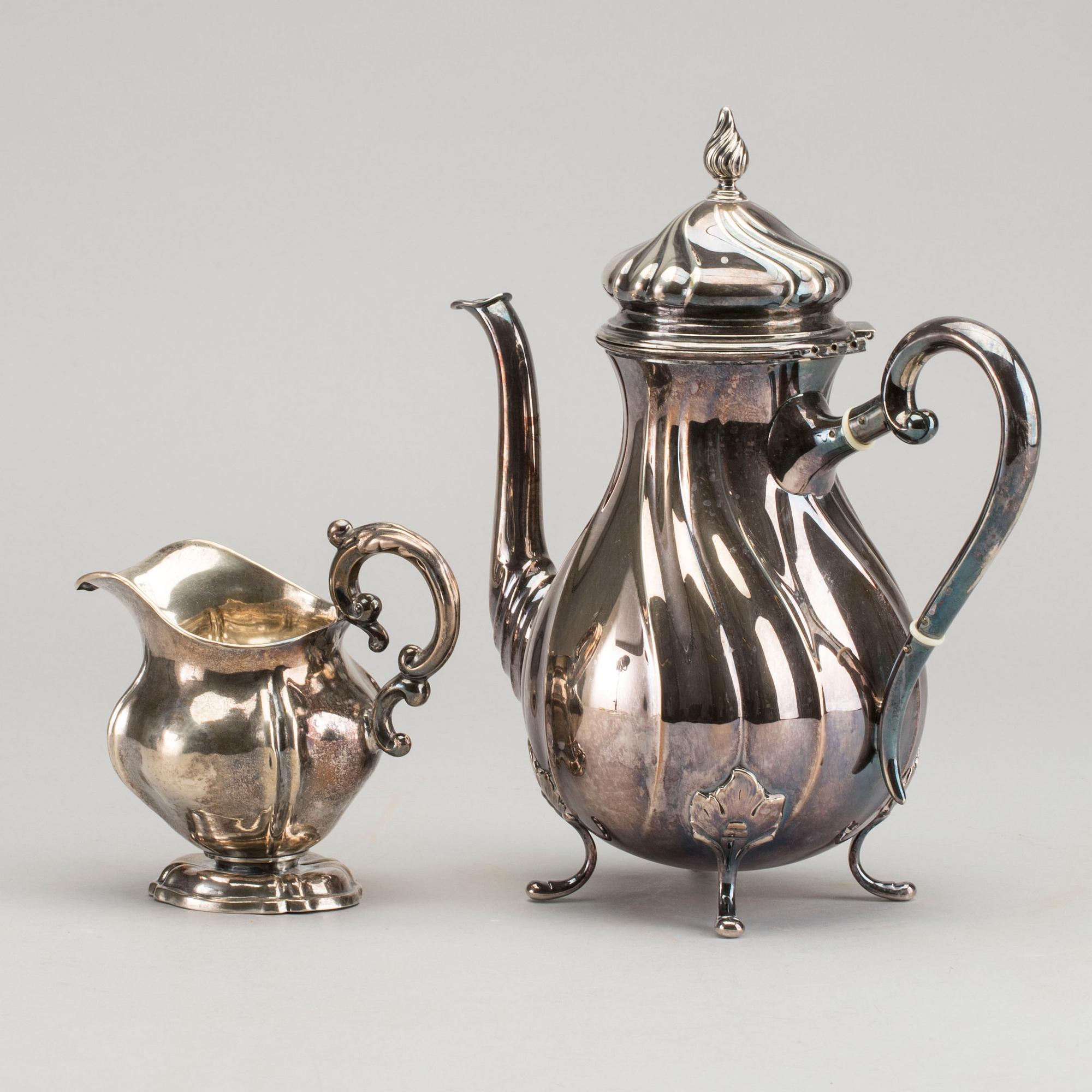 A DANISH COFFEE POT AND A SWEDISH CREAMER, silver.