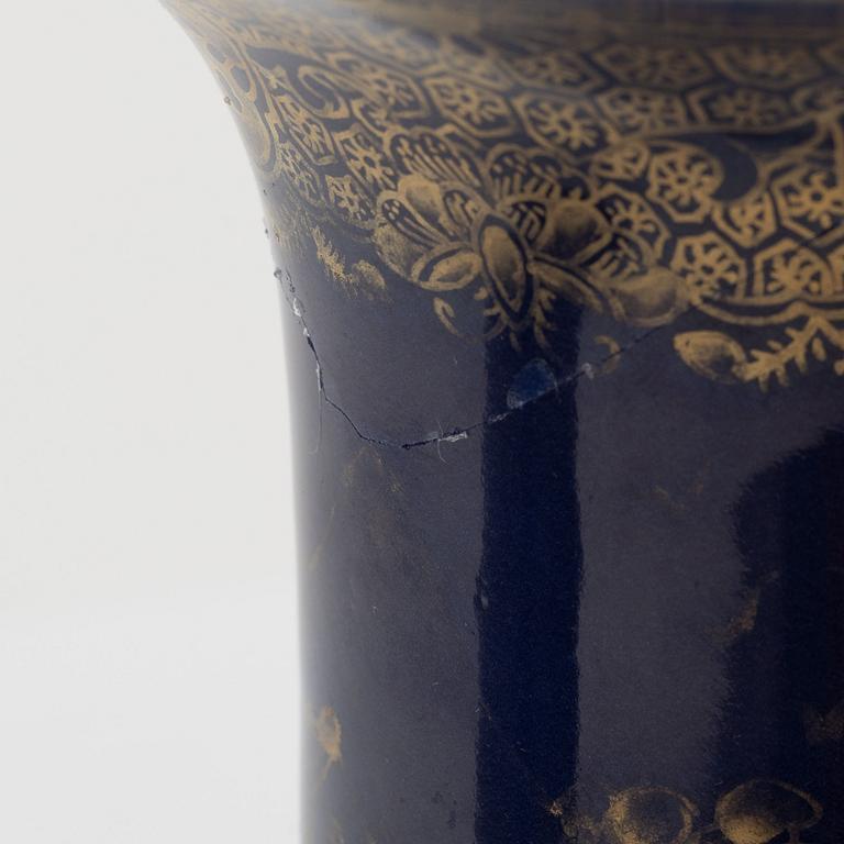 A pair of powder blue and gold 'trumpet' vases, Qing dynasty, 18th century.