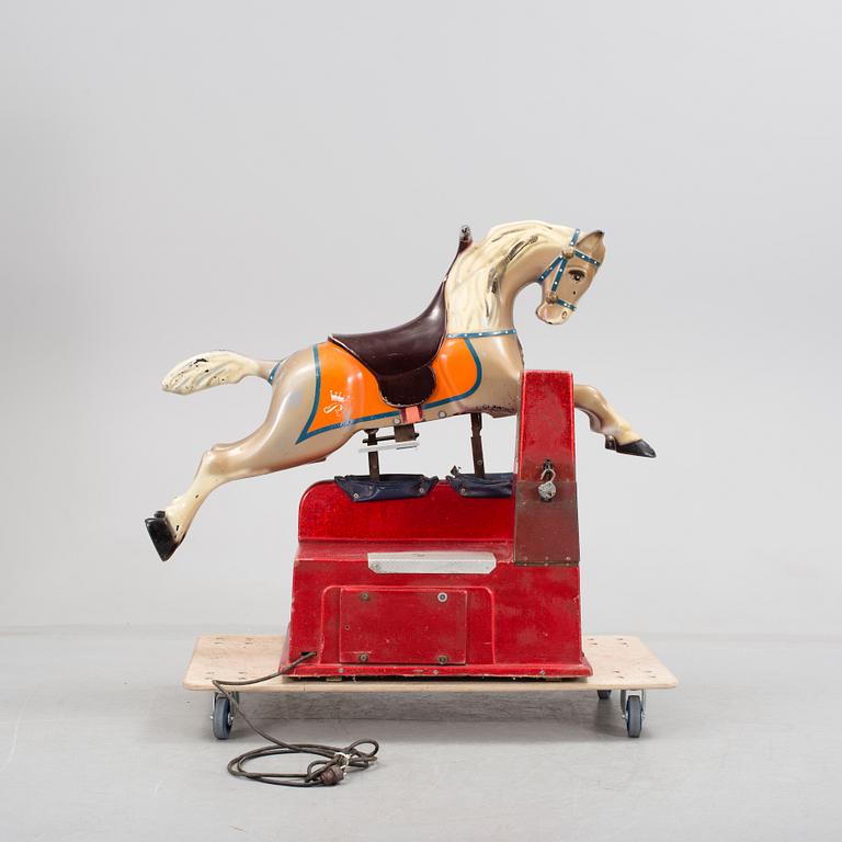 A motorized fiberglass horse probably 1970s.